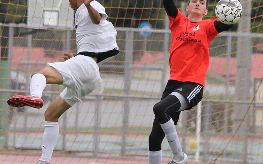 Golden Boot winner Imani Washington of Kubasaki can't get it past Seoul American keeper Sam Mitchell.