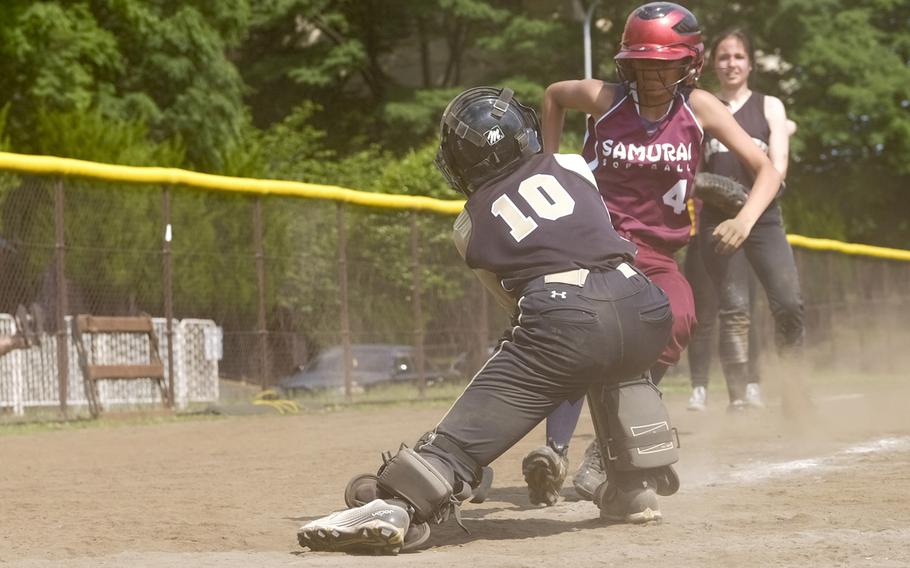 Humphreys' Tatyanna Hyman tags Matthew C. Perry's Veronica Muro at the plate during the Far East Division II Softball Tournament 7th place game at Yokota Air Base, Japan on May 20, 2015. Perry won 19-1.