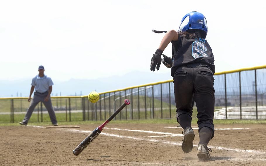 Osan's Renelyn Paat lays down a bunt single against Zama in the Far East Division II Softball Tournament semifinal at Yokota Air Base, Japan on May 20, 2015. Osan lost to Zama, 15-10.