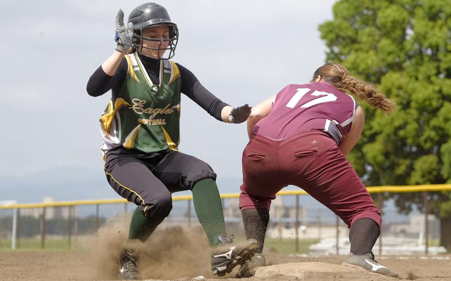 Robert D. Edgren's Destiny Garcia beats the throw to Matthew C. Perry's Tenacity Clayton at third base during the Far East Division II Softball Tournament consolation rounds at Yokota Air Base, Japan on May 20, 2015. Edgren defeated Perry 11-10.
