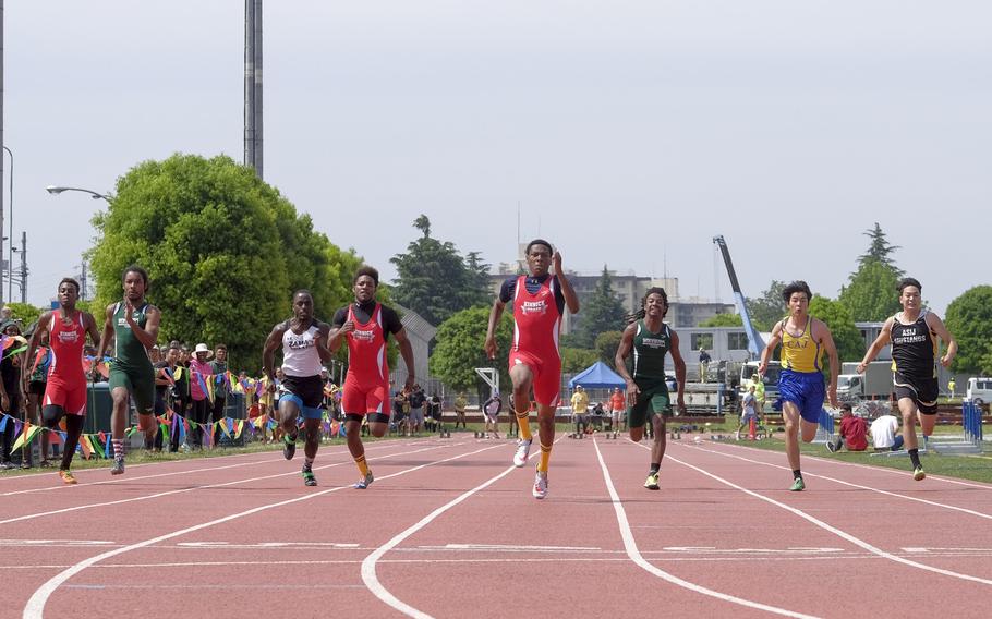 Nile C. Kinnick's Jabari Johnson leads the 100-meter dash May 22, 2015  during the far East Track and Field Tournament at Yokota Air Base, Japan. Johnson won with a time of 11.2 seconds. 