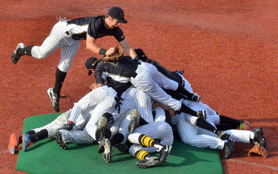 American School In Japan players celebrate their second straight Far East Division I baseball title and third overall.