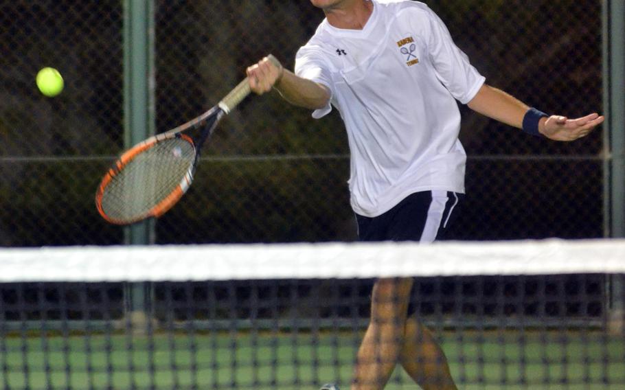 Kadena's Matt Sellers makes an approach to the net during Thursdays' doubles portion of an Okinawa Athletics & Activities Council tennis tie at Kadena Air Base's Risner Tennis Complex. Sellers teamed with Rylan Santos to win the boys doubles 8-6 over Kubasaki's Zach Davis and Mori Rempola, then with Youki Vivacqua to win mixed doubles 8-3 over Kubasaki's Ryo Elliott and Victoria Monreal.