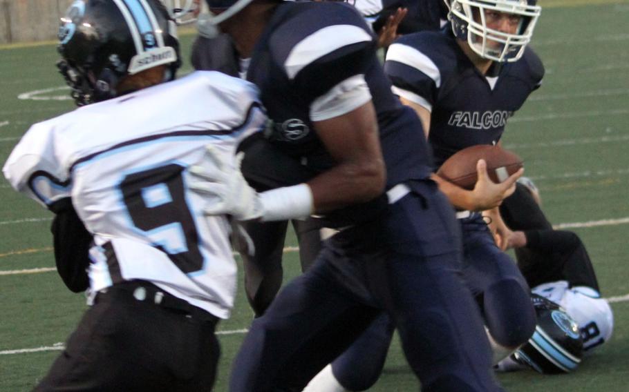 Seoul American quarterback Nick Mauldin rushes for one of his two running touchdowns in the Falcons' 69-0 romp over Osan on Friday.