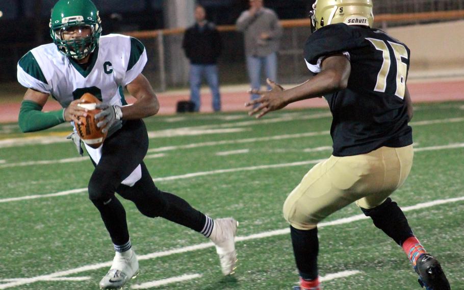 Daegu QB DeAndre Rosalie rolls right against Humphreys defender Marcus Childs.