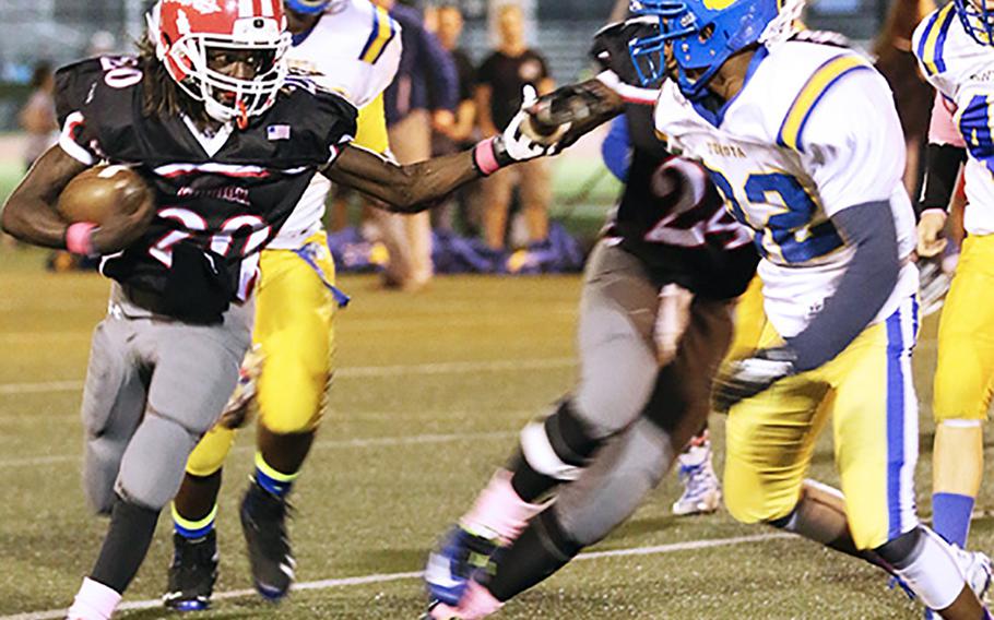 Nile C. Kinnick running back Chauncey Jamerson looks to cut outside on Yokota's C.J. Thomas.