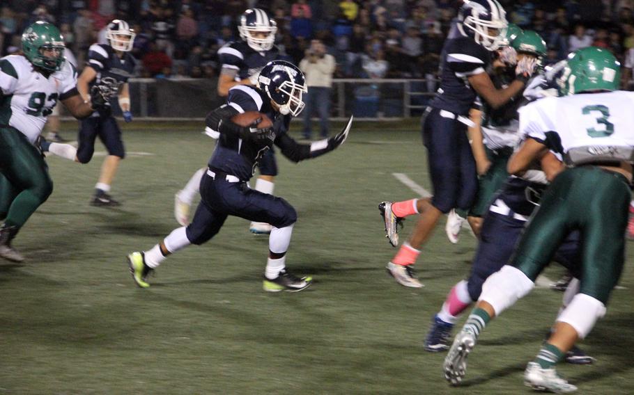 Seoul American RB Rico Howard looks for room to run through a season of Falcons teammates and Daegu High defenders on Oct. 9, 2015.