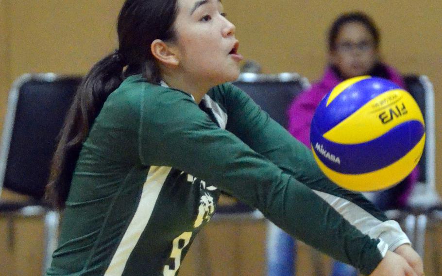 Kubasaki defender Maiya Larry receives a serve against New International School of Thailand during Friday's play in the American School In Japan Yujo Invitational Volleyball Tournament. The defending Far East Division I Tournament champion Dragons outlasted the Falcons 25-16, 25-16.
