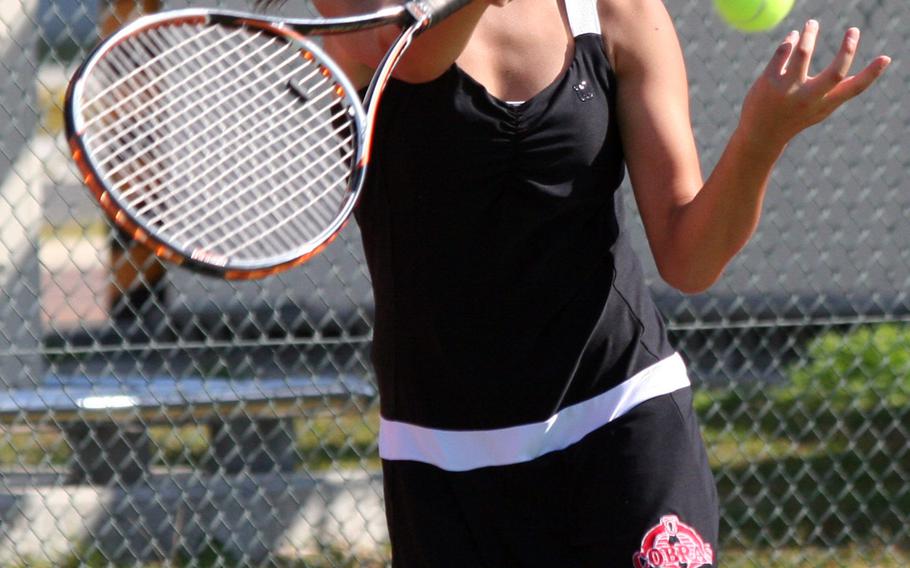 E.J. King's Megumi Kodama slaps a forehand return. She won one of two singles matches and each of her doubles ties against Matthew C. Perry and Nile C. Kinnick during a DODDS Japan weekend tri-meet.