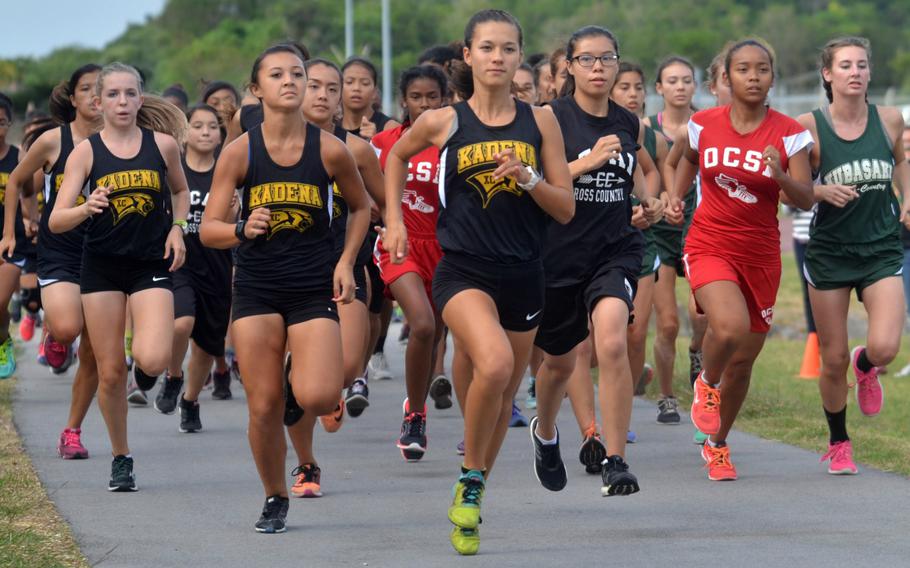 Kadena junior Wren Renquist, 3rd from left, begins picking up the pace Wednesday, Oct. 21, 2015, at the start of the Okinawa cross-country district finals. Renquist won with a time of 19 minutes, 35 seconds.