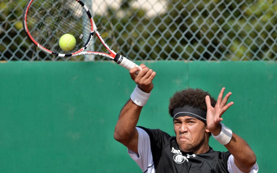 Zama's Trayland Rose goes high to smack a forehand against E.J. King's Rikki Kendall in Saturday's DODDS Japan boys tennis singles final, won by Kendall for the second straight year.