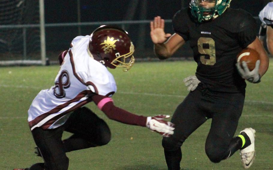 Daegu QB DeAndre Rosalie tries to outrun Matthew C. Perry defender Michael Perez.