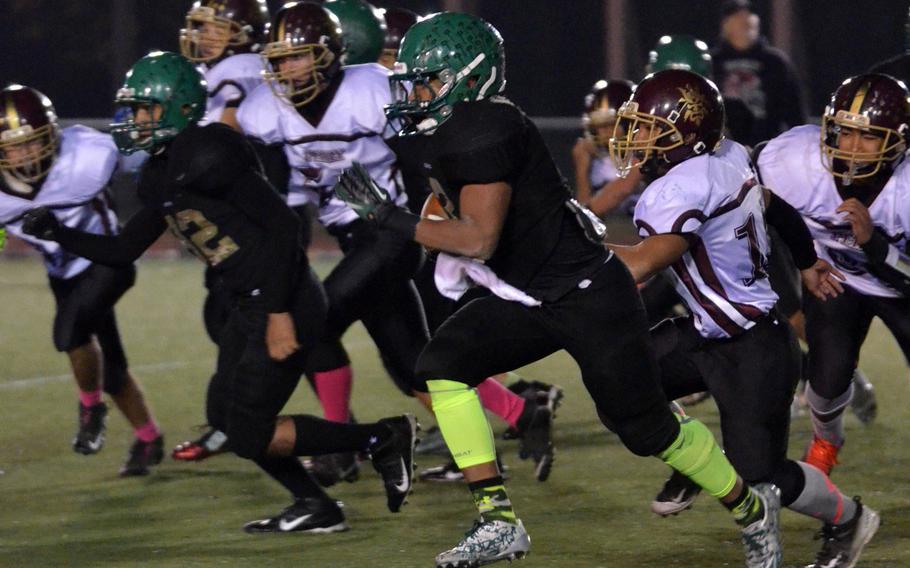 Daegu QB DeAndre Rosalie dashes past the Matthew C. Perry defense for one of his three rushing TDs.