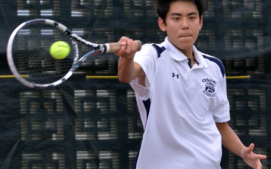 Osan's Kevin Polidan sends a forehand return against Yokota's Jacob Mansberger during first-round boys singles action in the Far East tennis tournament. Polidan won 9-7, but lost to American School In Japan's Len Kamemoto 8-0 in the second round.