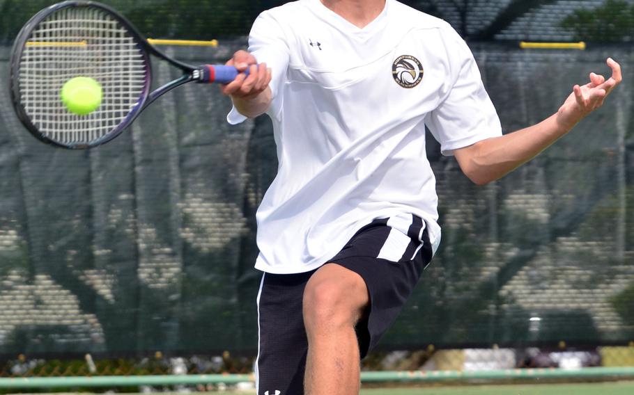 Humphreys' Ethan Cooper lunges for a forehand return against Matthew C. Perry's Isaac Lewis during first-round boys singles action in the Far East tennis tournament. Lewis won 8-3.