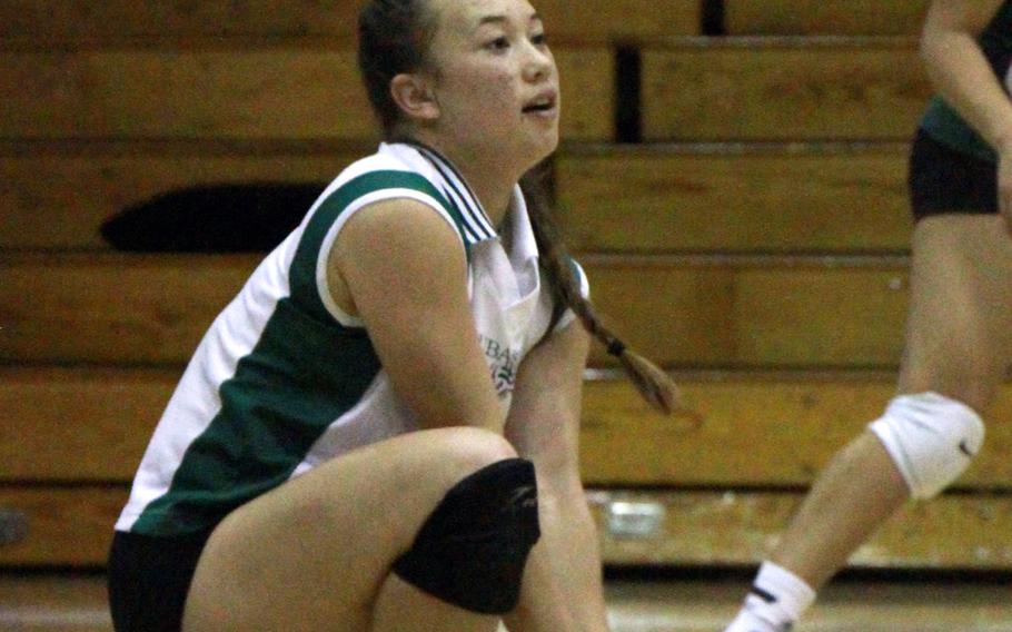Jordyn Deleon Guerrero digs the ball during Monday's round-robin play in the Far East Division I volleyball tournament. The Dragons won three of their four matches on Monday, losing only to American School In Japan -- the team they beat for the tournament title last year.