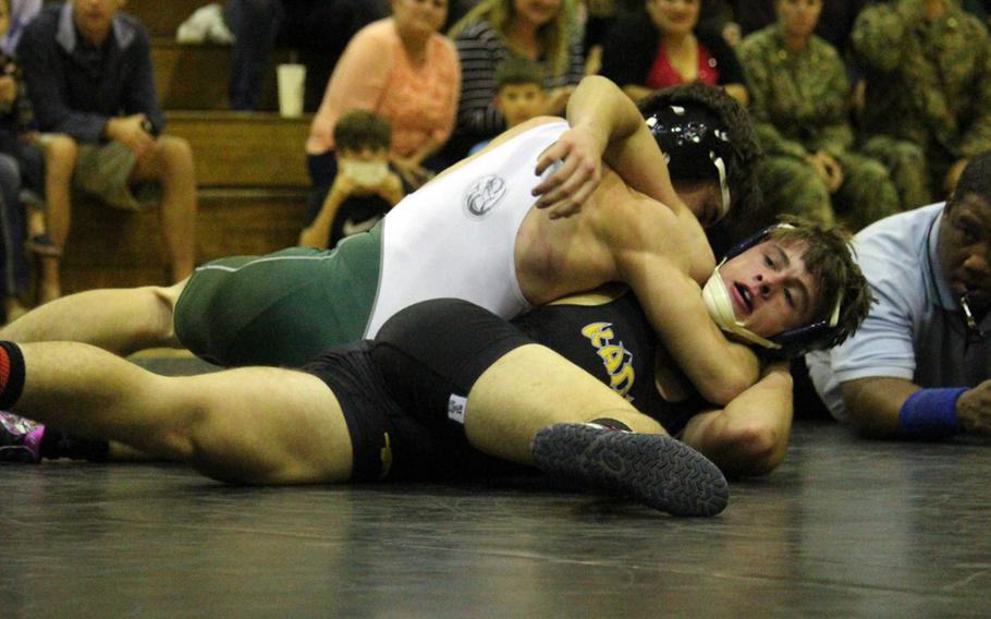 Kubasaki's Gavin Duenas enjoys a brief advantage over Kadena's Hunter Corwin in the 158-pound bout of Tuesday's Okinawa district season-opening wrestling dual meet. Corwin rallied for a 12-2 technical-fall victory in 3 minutes and the Panthers outlasted the Dragons 33-29.
