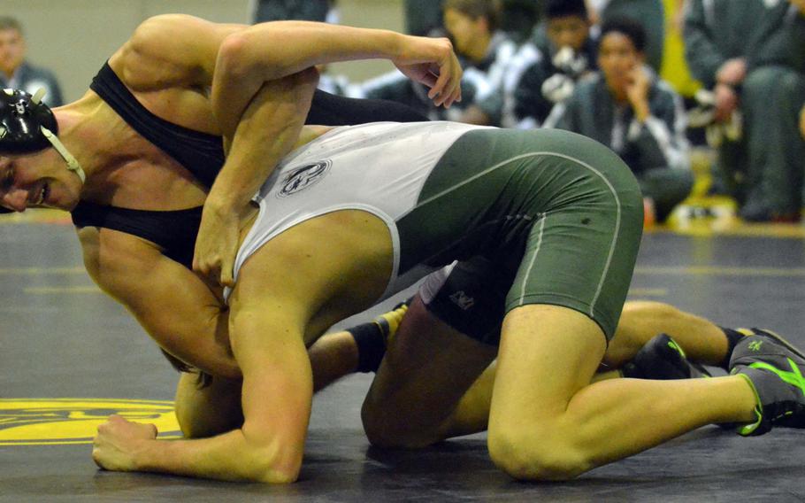 Kadena's Dominic Santanelli gains the upper hand on Kubasaki's Brenden Miracle in the 168-pound bout of Tuesday's Okinawa district season-opening wrestling dual meet. Santanelli won by technical fall 14-3 in 2 minutes and the Panthers outlasted the Dragons 33-29.