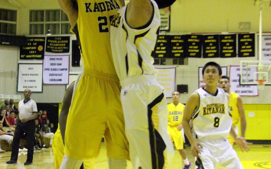 Kadena's Donte Savoy goes up for a shot against Kitanakagusuku during Friday's high school boys basketball game. The host Panthers fell 91-87 to the Fighting Lions.