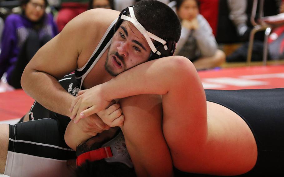 Zama's Jacob Martin polishes off Kinnick's Chris Deibel in the 275-pound first-place bout in the "Beast of the Far East" Wrestling Tournament.