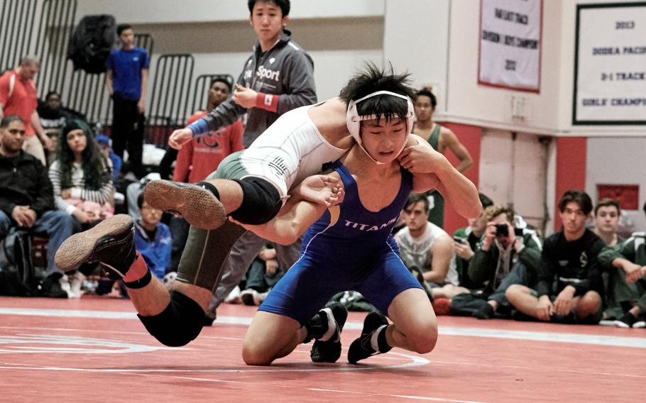 St. Mary's Chang Young Lee defeats Kristian Palmer of Kubasakii in the Beast of the East 122-pound finals Saturday, Jan. 9, 2016, at Nile C. Kinnick High School in Yokosuka, Japan. 