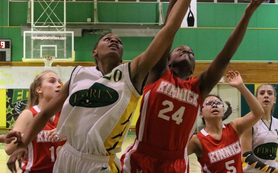 Edgren's Christina Taylor and Kinnick's Erica Alexander battle for the rebound during Friday's Japan girls basketball game, won by the Red Devils 38-34.