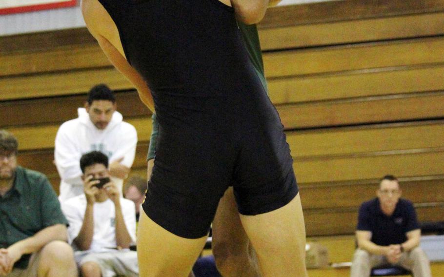 Kadena's Parker Corwin and Kubasaki's Josh Figueredo tangle in the combined 129-135-pound weight class in Saturday's Kadena Open wrestling tournament. Parker took first and Figueredo finished second.