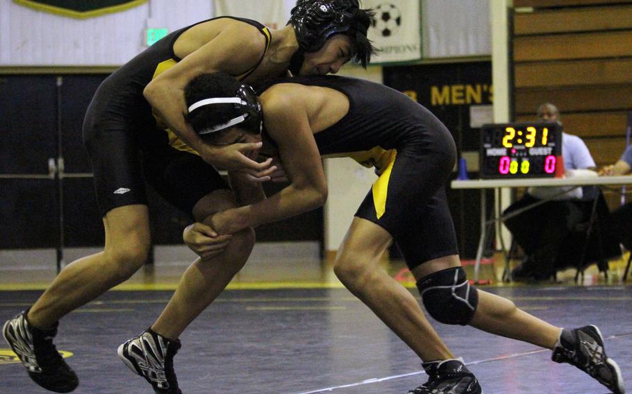 Kadena teammates Jadon Duenas and Demetrius DeLaRosa battle in the combined 101-108-pound weight class in Saturday's Kadena Open wrestling tournament. DeLaRosa finished third; Duenas did not place.