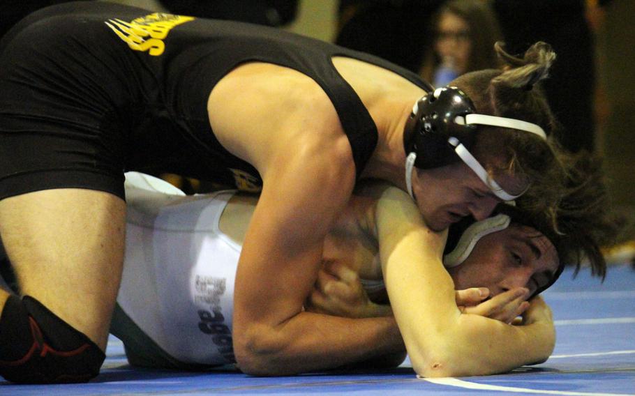 Kadena's Dominic Santanelli gets the upper hand on Kubasaki's Brendan Miracle in the 168-pound bout during Wednesday's regular season-ending dual meet. Santanelli pinned Miracle in 1 minute, 15 seconds and the Panthers rallied from 28-6 down to edge the Dragons 33-29 to win the meet.