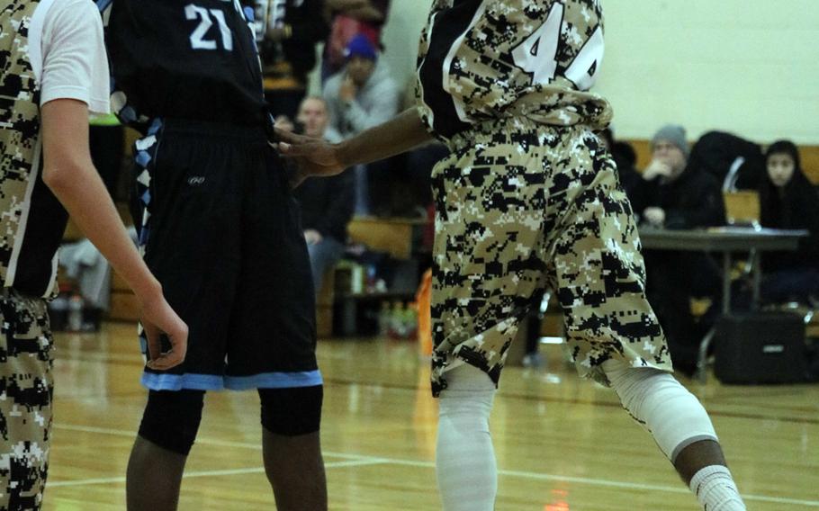 Osan's Darius Dawson shoots against Humphreys' Malik Dampier during Saturday's high school boys basketball game, won by the Blackhawks 52-36.