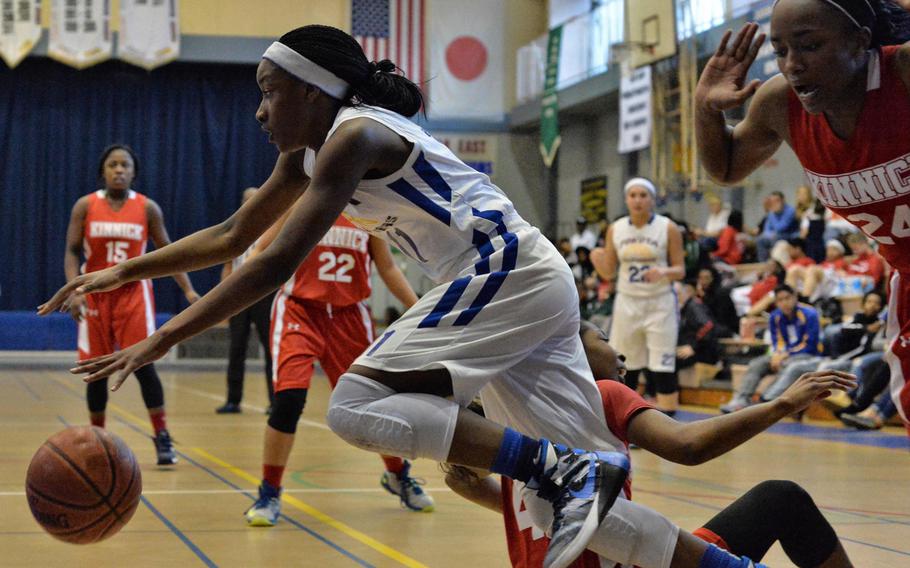 Yokota's Jamia Bailey tries to control the ball against Nile C. Kinnick during Friday's semifinal game in the DODDS Japan basketball tournament. The Panthers won 48-29 and will meet Zama for the title on Saturday.