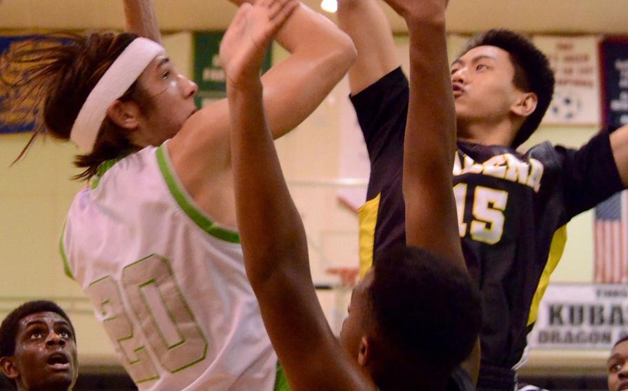 Kubasaki's Skylor Stevens shoots over Kadena's Josiah Santos during Friday's boys basketball game, won by the Dragons 67-49. Kubasaki completed a regular-season sweep of the Panthers with the win.