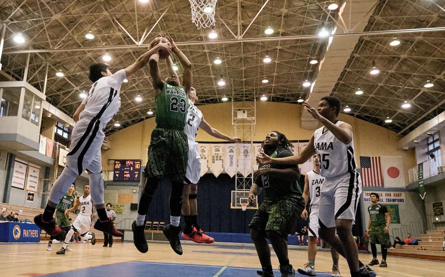 Daegu's Bishop Fields' shot is rejected by Zama's Hikari Nakamura and Anthony Ames during the Far East Tournament round robin Feb. 15, 2016 at Yokota Air Base, Japan. Daegu defeated Zama 49-43. 