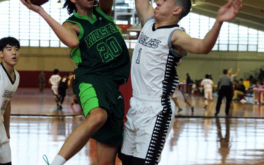 Kubasaki's Skylor Stevens looks for a lane around CAJ's Takero Muari's defense during Kubasaki's 67-21 Far East Tournament round robin victory Feb. 15, 2016 at Camp Foster in Okinawa, Japan.  