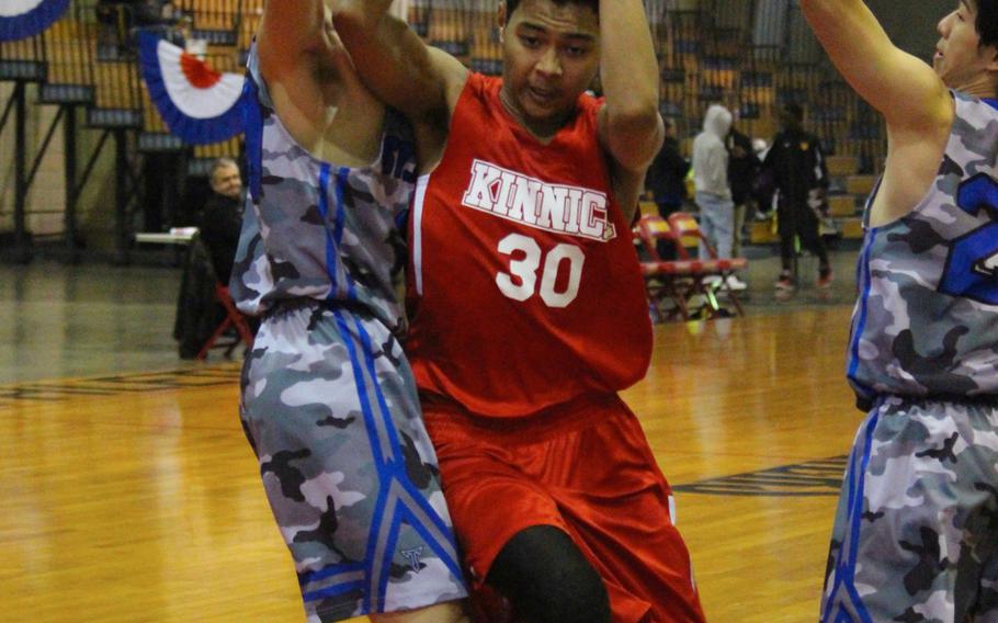 Kinnick's Tarik Deadmon finds space in the St. Mary's defense during Kinnick's 72-47 Far East Tournament round robin loss Feb. 15, 2016 at Camp Foster in Okinawa, Japan.  