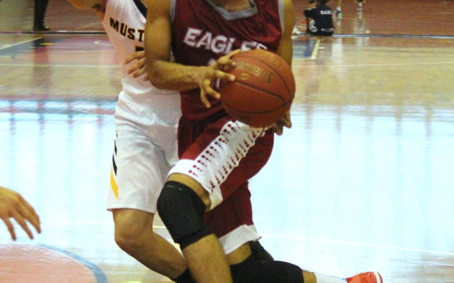 American School of Bangkok's Guntapong Korsah-Dick finds a lane past ASIJ's Ray Shino during ASB's 64-62 Far East Tournament round robin overtime win Feb. 15, 2016 at Camp Foster in Okinawa, Japan.  
