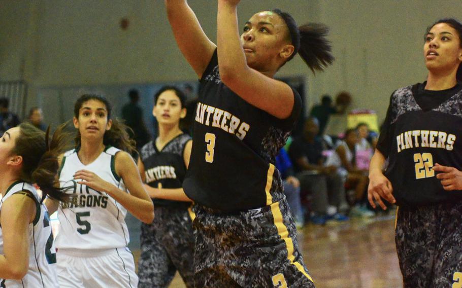 Kadena's Rheagan Wyche finds an opening in the Kubasaki defense during a 40-16 Far East Tournament round robin win over the Dragons Feb. 15, 2016 at Camp Foster in Okinawa, Japan.  