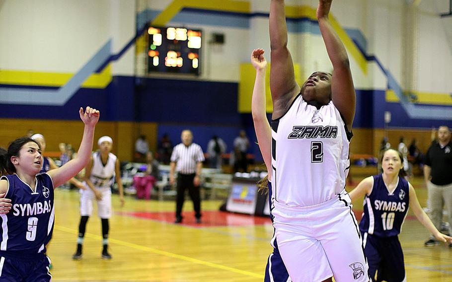 Zama's Destiny Thomas attempts a layup during the Far East Tournament Girls Division II pool play at Marine Corps Air Station Iwakuni, Japan on Tuesday, Feb. 16, 2016.  

Ryan Archambault/Special to Stars and Stripes