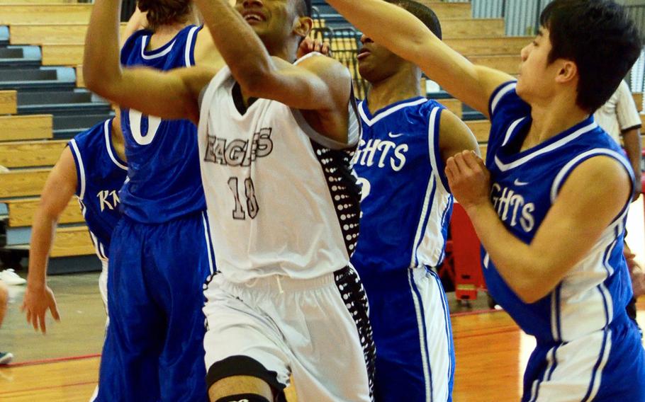 American School of Bangkok's  Guntapong "Tony" Korsah-Dick drives past CAJ's Takero Muari during the Far East Tournament Boys Division I pool play at Camp Foster in Okinawa, Japan on Tuesday, Feb. 16, 2016.  