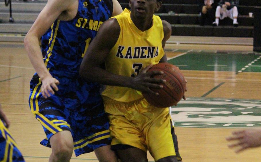 Kadena's Isaiah Richardson drives past St. Mary's Lane Woody during the Far East Boys Division I Tournament on Wednesday, Feb. 17, 2016 at Foster Field House in Okinawa, Japan.