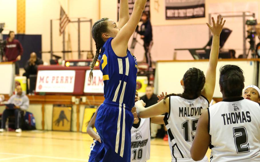 Yokota's Caitlyn Rowan puts up a shot in the Panthers' 50-24 victory over Zama in the Far East Girls Division II Basketball Championships title game on Thursday.