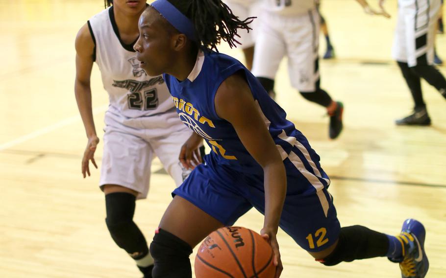 Yokota's Jamia Bailey dribbles toward the corner in the Panthers' 50-24 victory over Zama in the Far East Girls Division II Championships title game on Thursday.