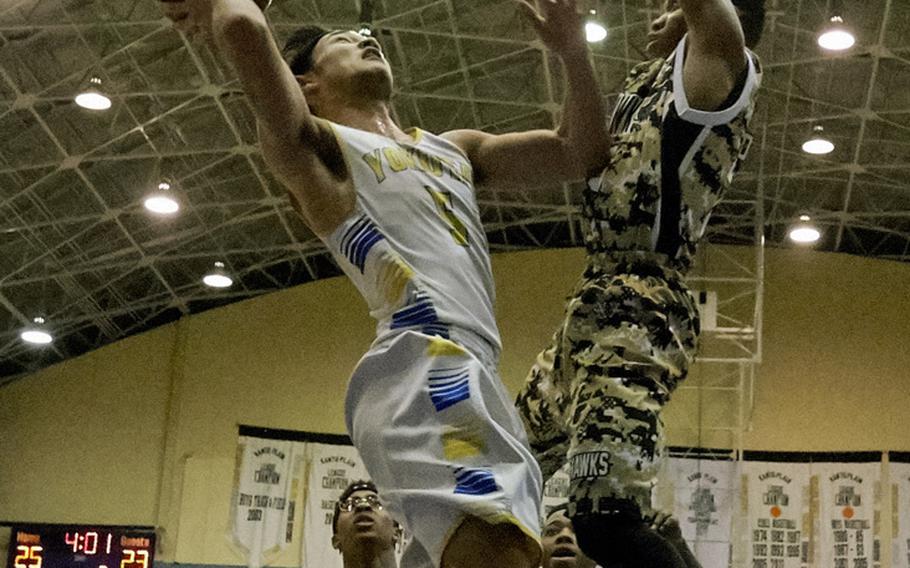Yokota's Shota Sprunger attempts a layup during the Far East Tournament Boys Division II championship game Feb. 18, 2016 at Yokota Air Base, Japan. Sprunger led all scorers with 23 points in the game. 