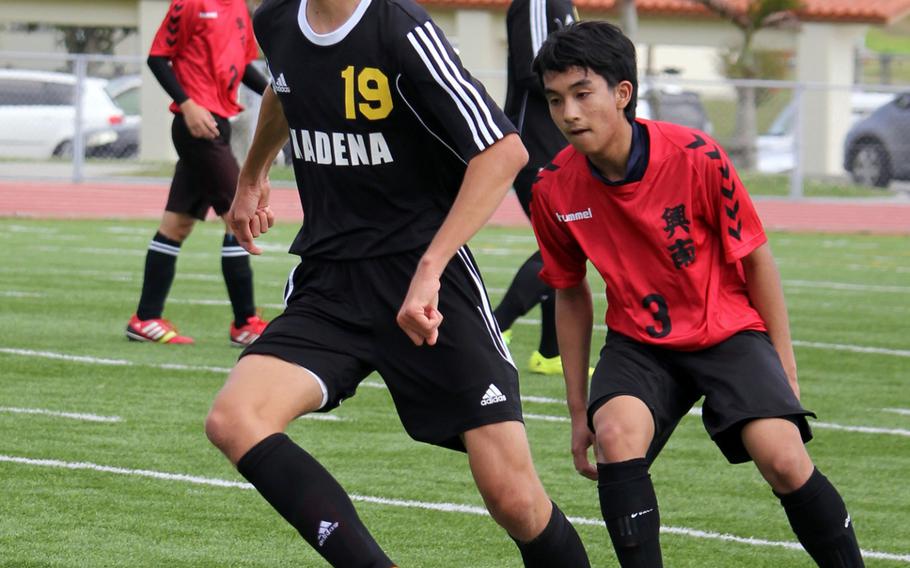 Kadena's Guy Renquist swerves to avoid a Konan defender during Saturday's high school boys soccer match. Konan rallied from a 2-0 halftime deficit to edge the Panthers 3-2.