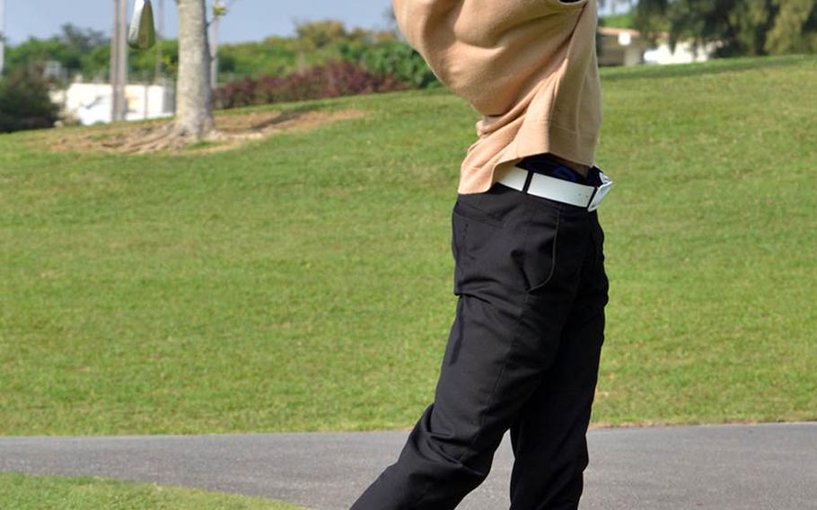 Kadena senior Jonathan Moore strikes an iron approach to the sixth green during Tuesday's scramble format play against Kubasaki at the Banyan Tree Golf Course, Kadena Air Base, Okinawa. Moore and his three teammates won the day with a two-under 34 on the par-36 front nine.