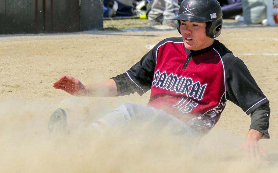 Perry's Peace Gates slides in safe at home during Saturday's 8-1 Samurai victory over defending Far East Division II champion Yokota.