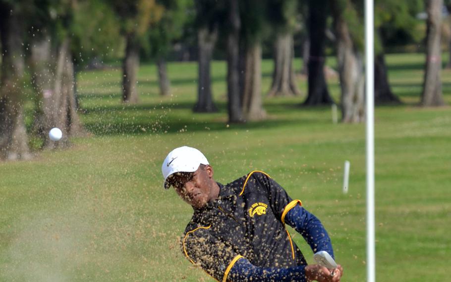 Kadena senior Jonathan Moore blasts out of a bunker on the Banyan Tree Golf Course at Kadena Air Base on Tuesday, March 29, 2016. Playing modified Stableford scoring rules, Moore bested the three other players in his group by carding 22, two strokes ahead of teammate Jonathan Henry and three in front of Kubasaki's Eric Heck. Teammate Carter Hanamura carded an 11.