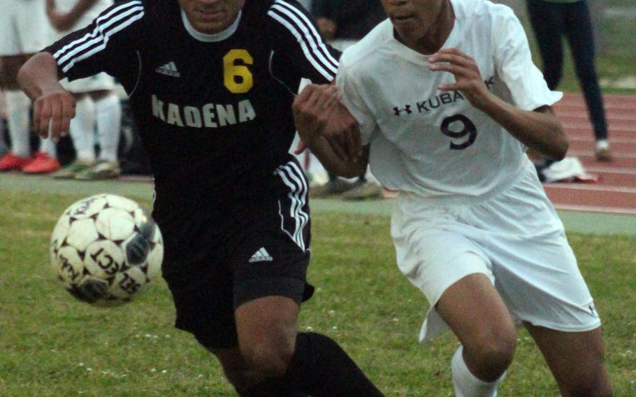 Kadena's Quentin Moore and Kubasaki's Ryo Elliot chase the ball during Wednesday's boys soccer match, won by the Dragons 2-0.