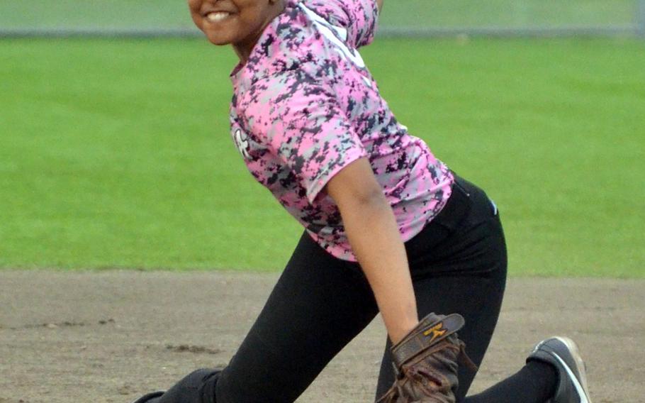 Kadena senior second baseman Rheagan Wyche rears up to throw to first base from her knees during Thursday's softball game. Wyche tripled in a run for the Panthers in their 18-3, five-inning victory over Kubasaki. The Panthers lead the season series 2-1.