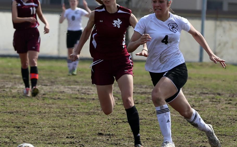 Perry's Naomi Ziola and Zama's Georgia Tsitiridis give chase for the ball during Saturday's girls soccer match, won by the Samurai 2-1. Perry went 1-0-1 on the weekend in a matchup of DODEA-Japan's top two soccer teams.